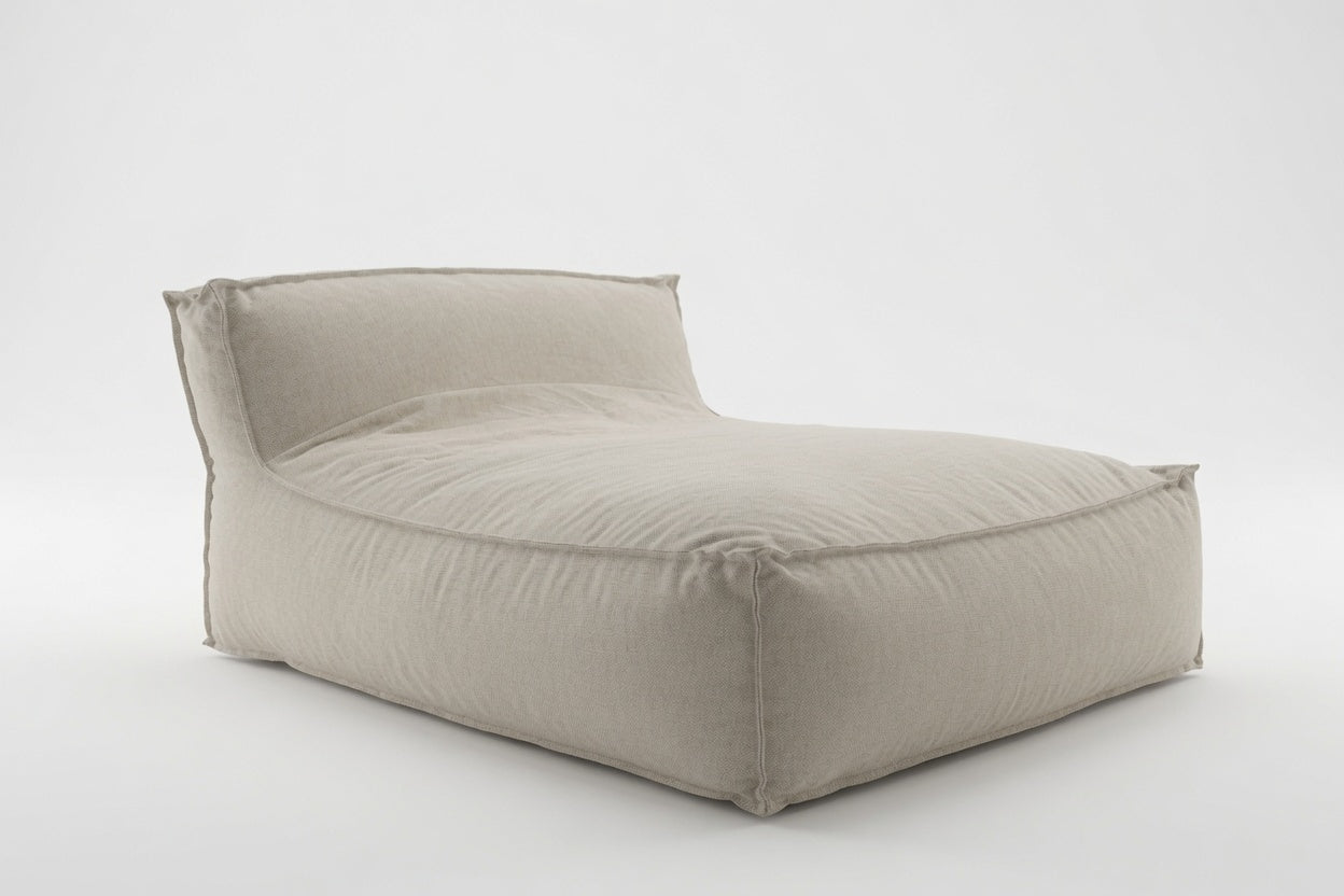 A modern, low-profile modular floor cushion daybed in a light beige linen fabric, photographed on a seamless light gray studio background.