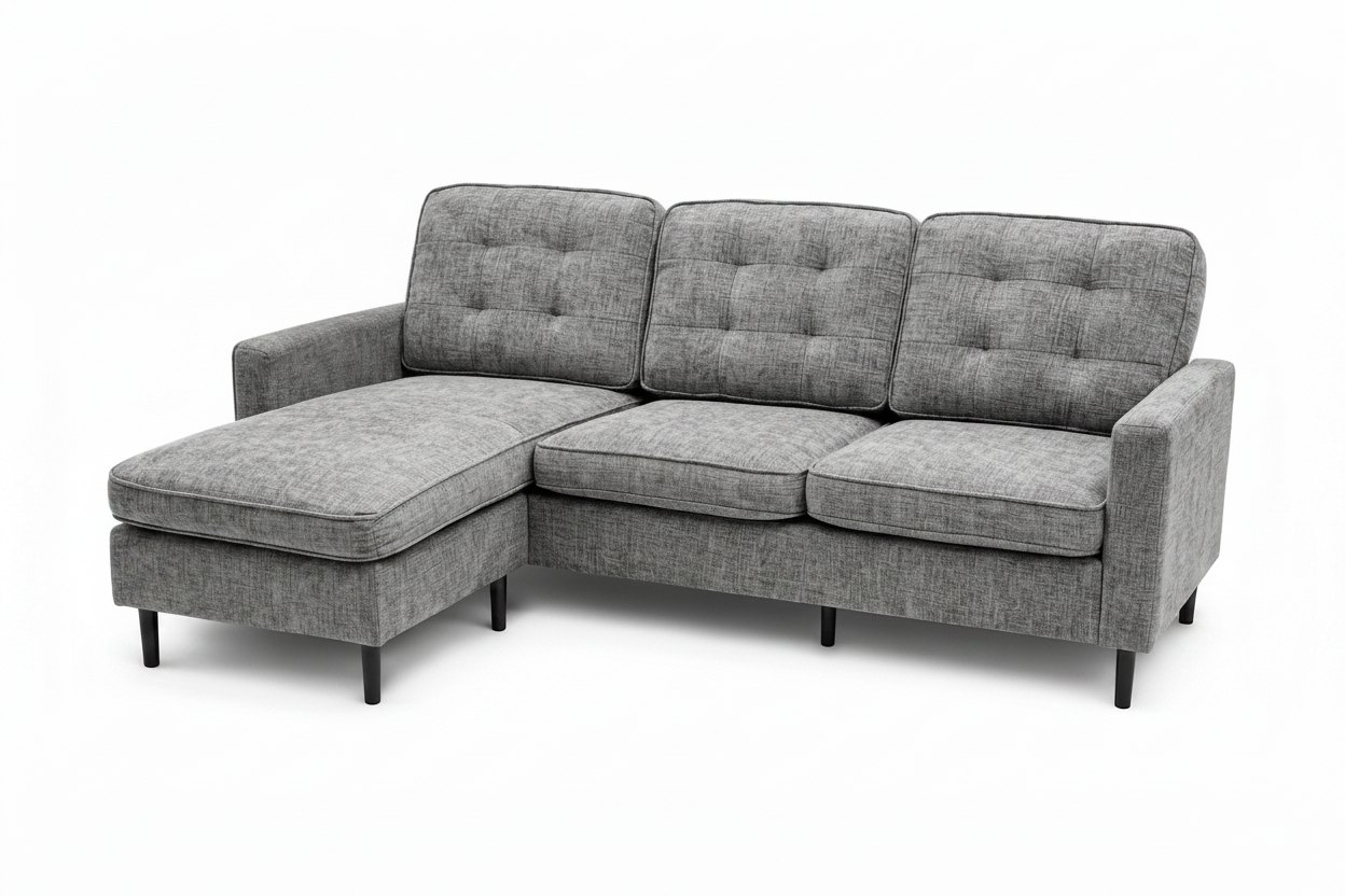 A gray upholstered sectional sofa with a left-facing chaise lounge, featuring tufted back cushions, three seat cushions, and slim black legs, shown against a plain white background.