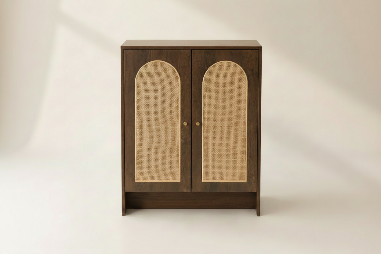 A walnut color cabinet with two doors featuring arched woven cane panels, set against a warm beige background.
