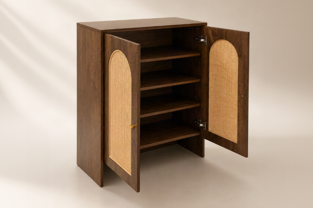 A dark brown wooden cabinet with two doors swung open to reveal three interior shelves and a woven cane panel on each door, set against a warm beige background.