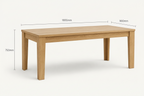 Oak dining table shown on a light gray background with dimension lines and text indicating 1800 mm length, 900 mm width, and 750 mm height. Small feature icons along the bottom mention oak finish, sturdy and durable, comfortable seats, and natural wood grain.