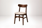 Two wooden chairs with upholstered seats on a white background
