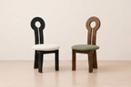 Two chairs with unique back designs on a plain background