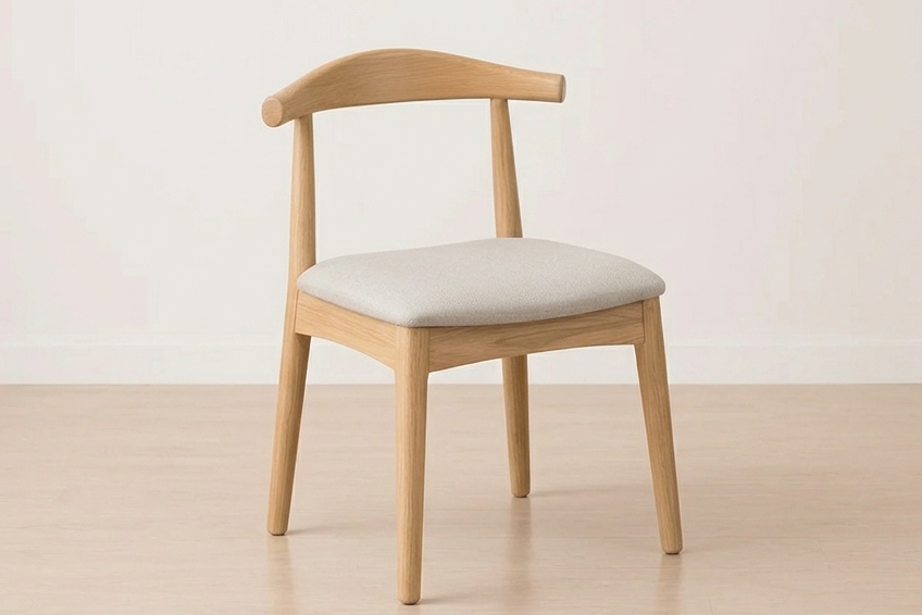 The wooden chairs with cushioned seats on a light background