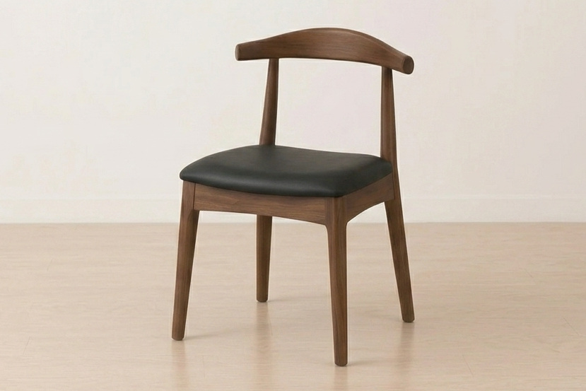 Wooden chair with black leather seat on a beige background